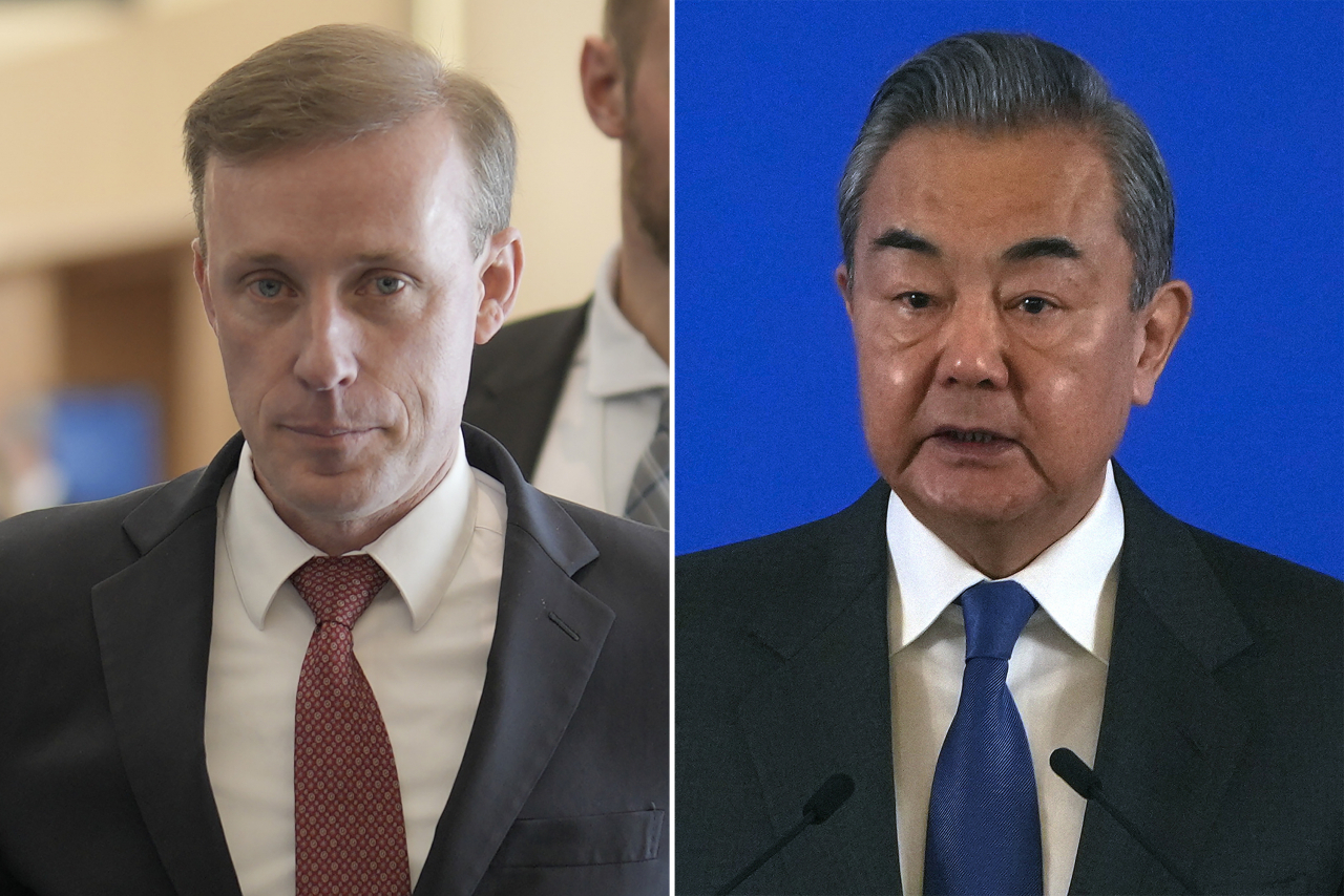 This photo shows US National Security Advisor Jake Sullivan (left) and Chinese Foreign Minister Wang Yi. (AFP-Yonhap)