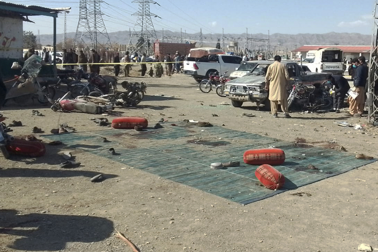 Security officials examine the scene of a bomb blast in Khanozai, Pashin, a district of Pakistan's Baluchistan province on Wednesday. (AP)