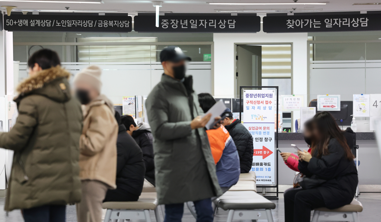 People are waiting for consultations at a local job center in Seoul. (Yonhap)