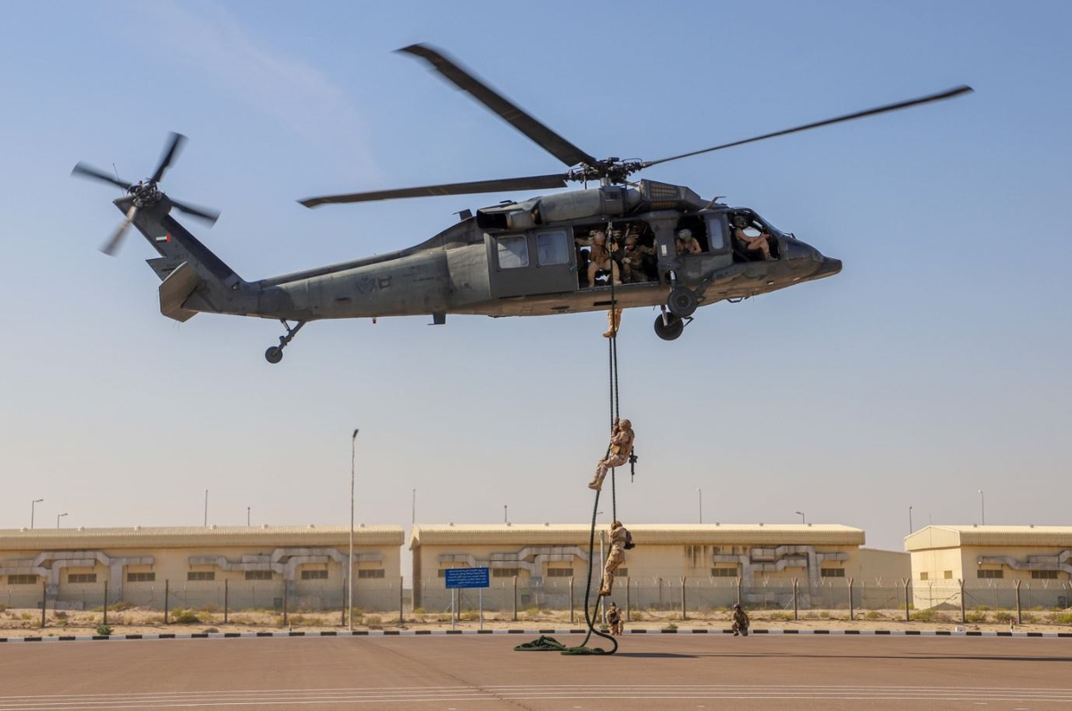 This photo, provided on Tuesday, shows troops rappelling from a helicopter during combined drills with UAE personnel in the Middle Eastern country. (Akh unit)