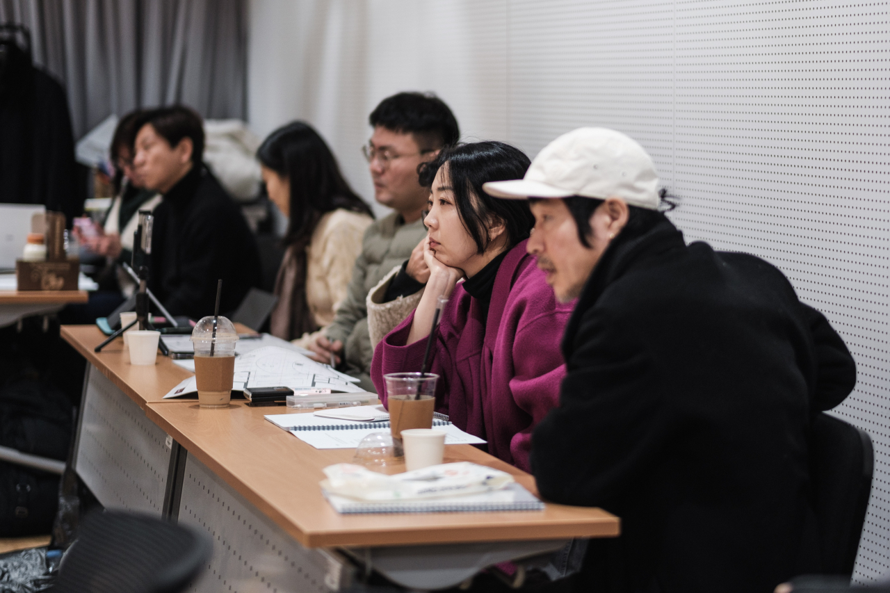 Director Kim Si-hwa (second from right) watches a rehearsal for 