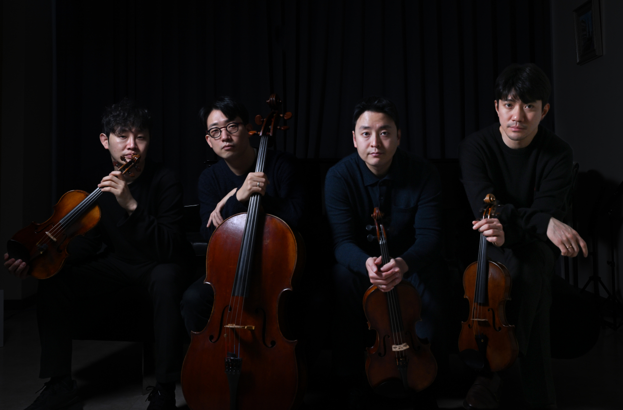 (From left) Members of the Novus String Quartet -- violinist Kim Jae-young, cellist Lee Won-hae, violist Kim Kyu-hyun and violinist Kim Young-uk -- pose for photos during an interview with The Korea Herald on Monday. (Im Se-jun/The Korea Herald)