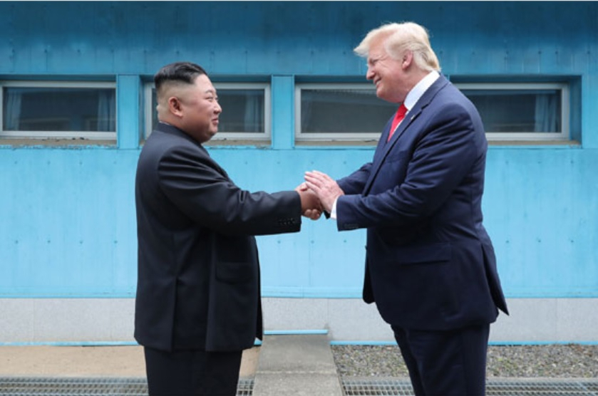 Former US President Donald Trump (right) shaking hands with North Korean leader Kim Jong-un at the inter-Korean border truce village of Panmunjom on June 30, 2019. (The Korea Herald)