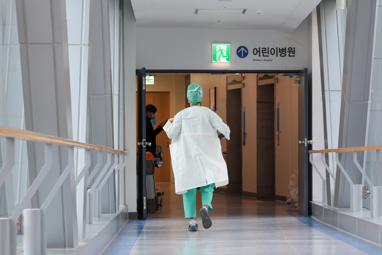 A doctor is seen walking around a hospital in Seoul on Wednesday. (Yonhap)