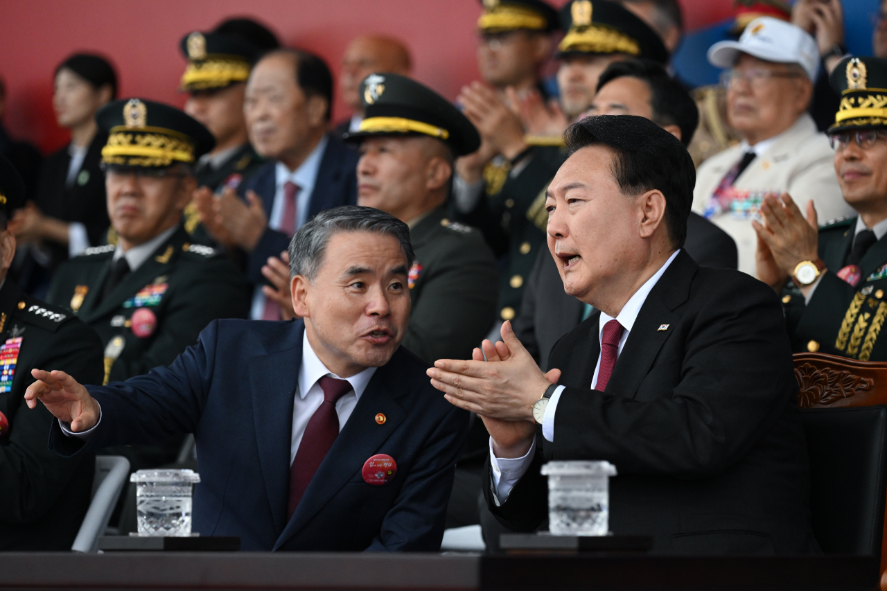 Then-Minister of National Defense Lee Jong-sup, left, speaks to President Yoon Suk Yeol during a ceremony marking the 75th Armed Forces Day at Seoul Air Base in Seongnam, Gyeonggi Province, Sept. 26, 2023. (Courtesy of the Presidential Office)