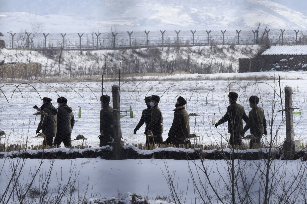 North Korean soldiers patrol along fences in the border county of Uiju, North Pyognan Province in North Korea on Dec. 22, 2022. (Getty Images)