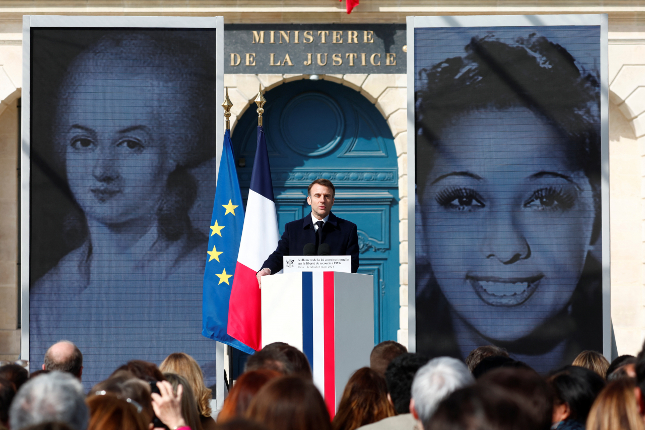 French President Emmanuel Macron speaks during a ceremony to seal the right to abortion in the French constitution, on International Women's Day, at the Place Vendome, in Paris, France on Friday. (Pool via Reuters)