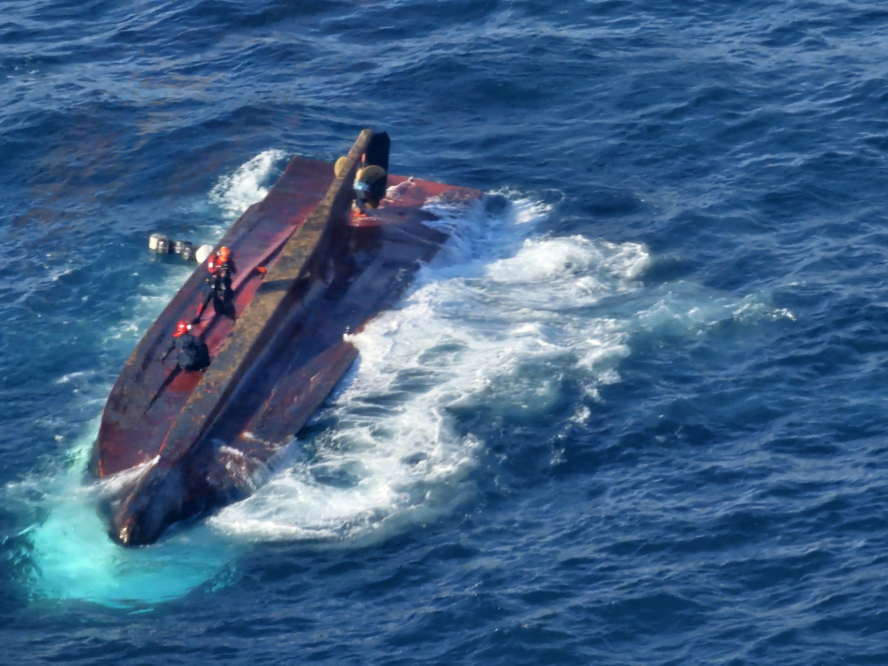 Rescue operations are under way after a 20-ton fishing vessel capsized in waters off the southern coastal city of Tongyeong on Saturday. (Coast Guard)