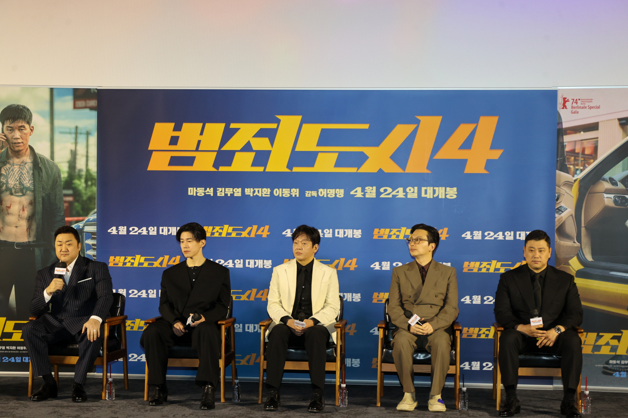 From left: “The Roundup: Punishment” actors Don Lee, Kim Moo-yeol, Park Ji-hwan, Lee Dong-hwi and director Heo Myeong-haeng speak during a press conference held in Megabox Seongsu, Seoul, Monday. (Yonhap)