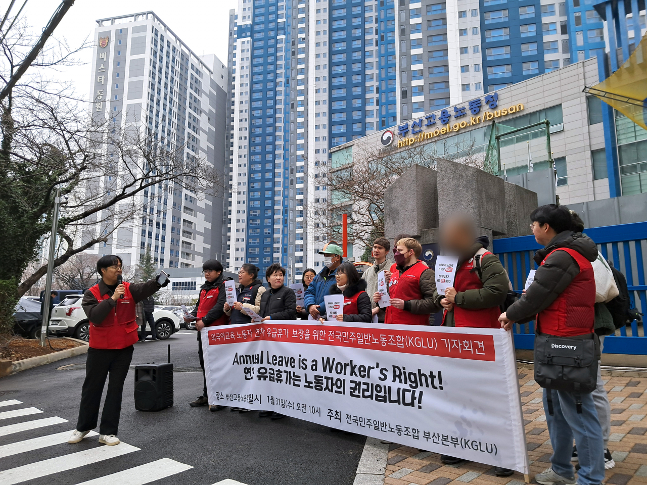 Foreign Language Education Workers’ Union members and staff hold a press conference advocating for native English teachers’ right to take annual leave, in front of the Busan Regional Office of the Ministry of Employment and Labor, Jan. 31. (Courtesy of Foreign Language Education Workers’ Union Busan Branch)