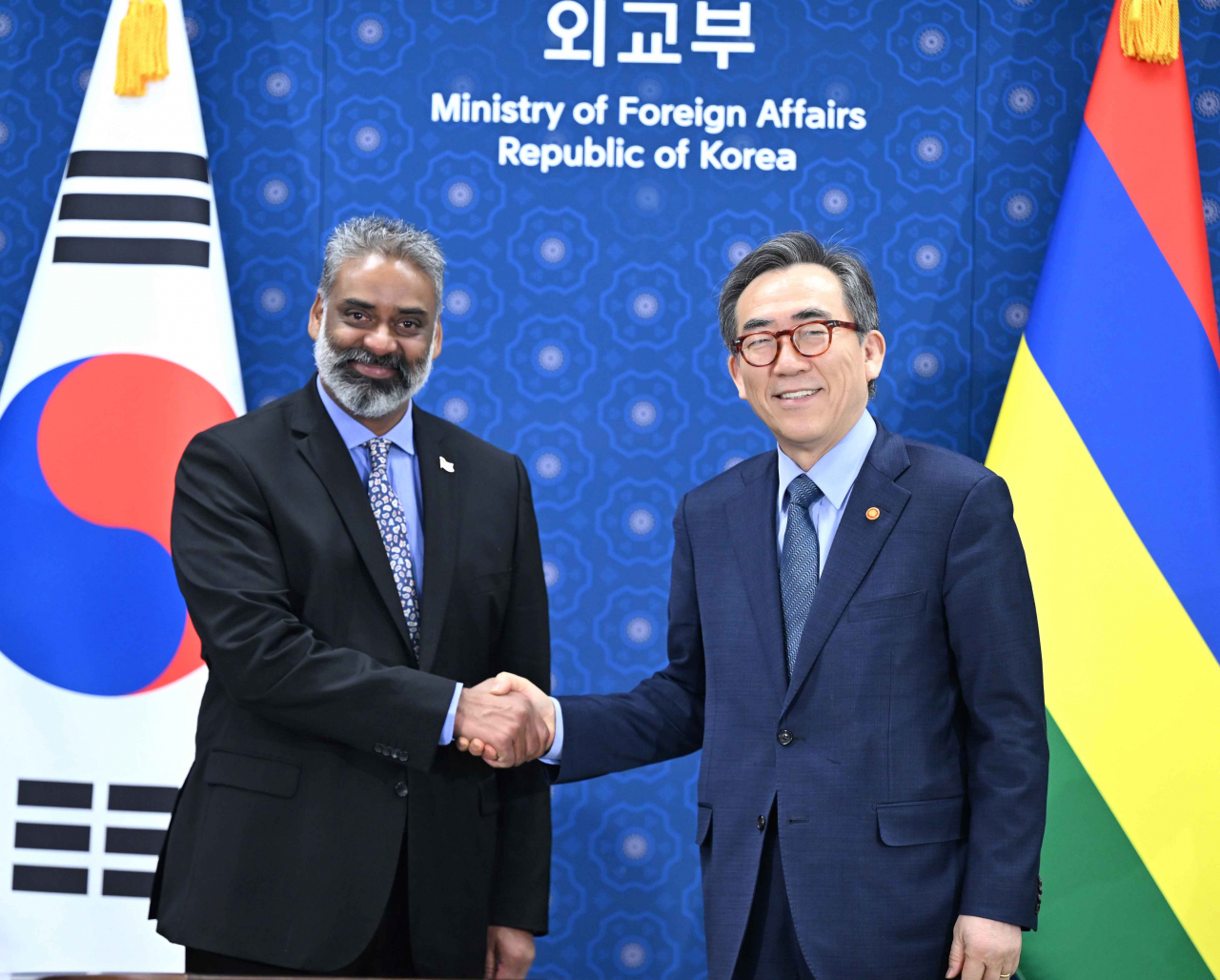 South Korean Foreign Minister Cho Tae-yul (right) shakes hands with Mauritius Foreign Minister Maneesh Gobin during their bilateral talks at the Foreign Ministry building in Seoul. The meeting take place during Gobin's visit to South Korea to attend the third Summit for Democracy hosted by the Yoon Suk Yeol government in Seoul. (Ministry of Foreign Affairs)
