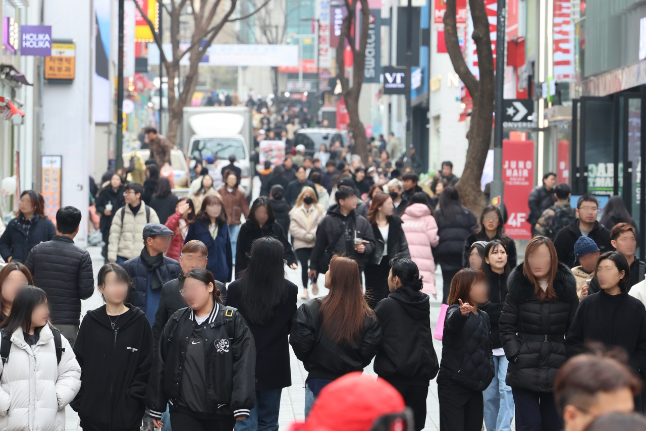 A street in Myeong-dong bustles with shoppers on March 5. (Yonhap)