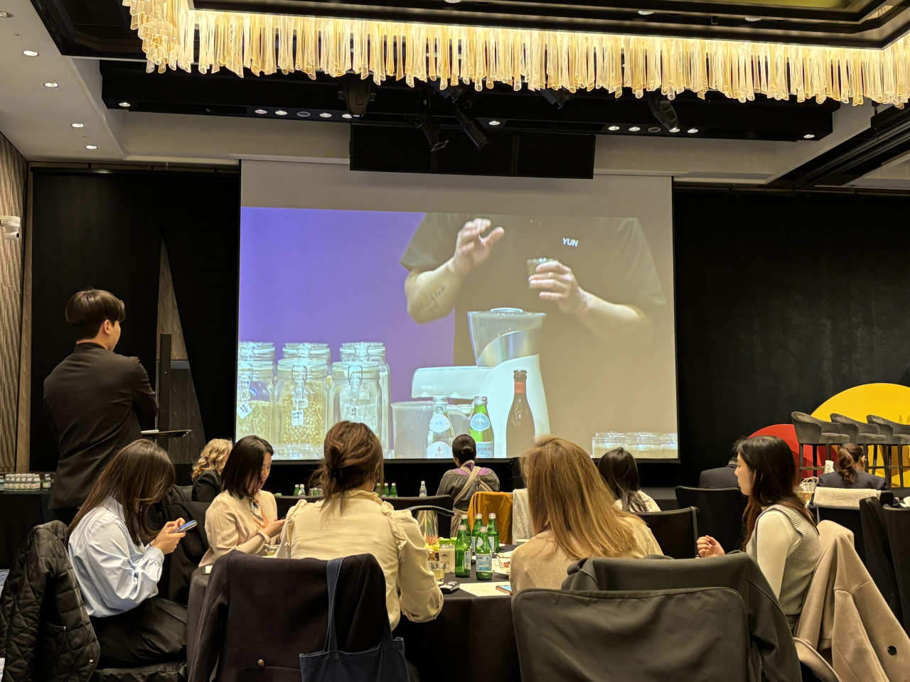 Chef Kim Do-yun demonstrates his recipe for naengmyeon, or buckwheat noodles in cold broth,at Asia’s 50 Best Restaurants 2024’s #50BestTalks held at Four Seasons Hotel Seoul on Monday. (Kim Da-sol/The Korea Herald)