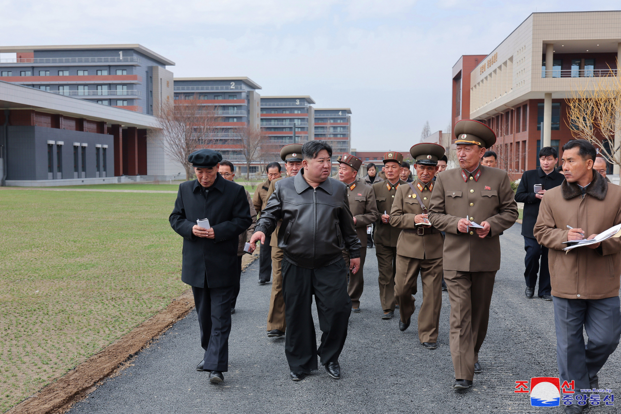 This photo shows Kim Jong-un inspecting a construction site of the North's ruling party training school on Sunday. (KCNA)