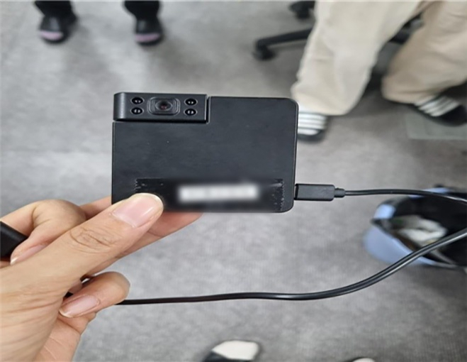 A file photo shows a picture of an illegal camera disguised as a charging adapter that was found at an early voting station in Yangsan, South Gyeongsang Province. (Gyeongnam Provincial Police)