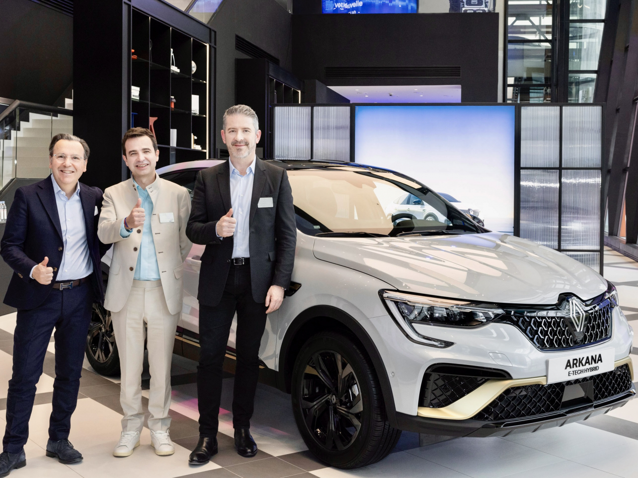 From left: Arnaud Belloni, Renault Group's vice president of global marketing, Stephane Deblaise, CEO of Renault Korea, and Gilles Vidal, the group's design director, stand next to the renamed Renault Arkana, formerly the XM3, during a press conference in Seoul on Wednesday. (Renault Korea)
