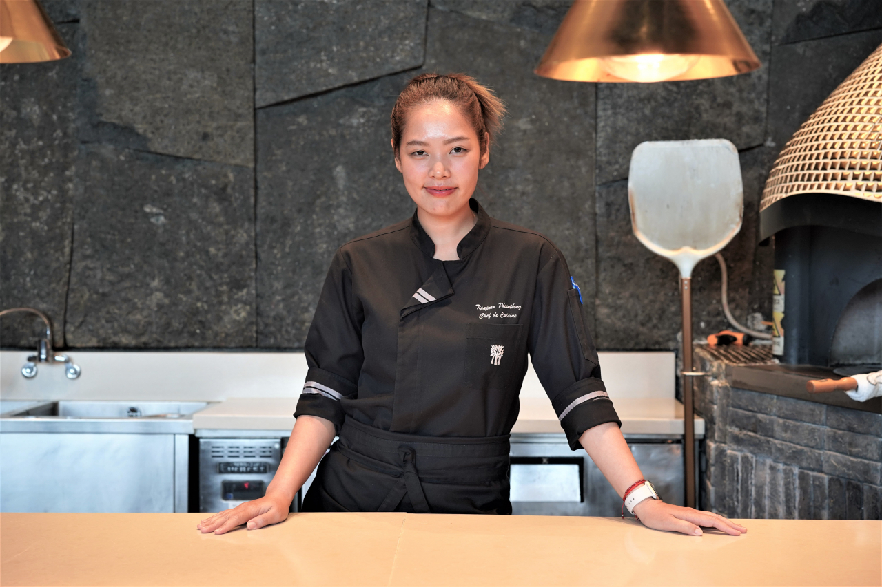 Chef Tipaporn Phianthong poses for photos at Banyan Tree Club & Spa Seoul's Granum Dining Lounge in Jung-gu, central Seoul, Tuesday. (Lee Si-jin/The Korea Herald)