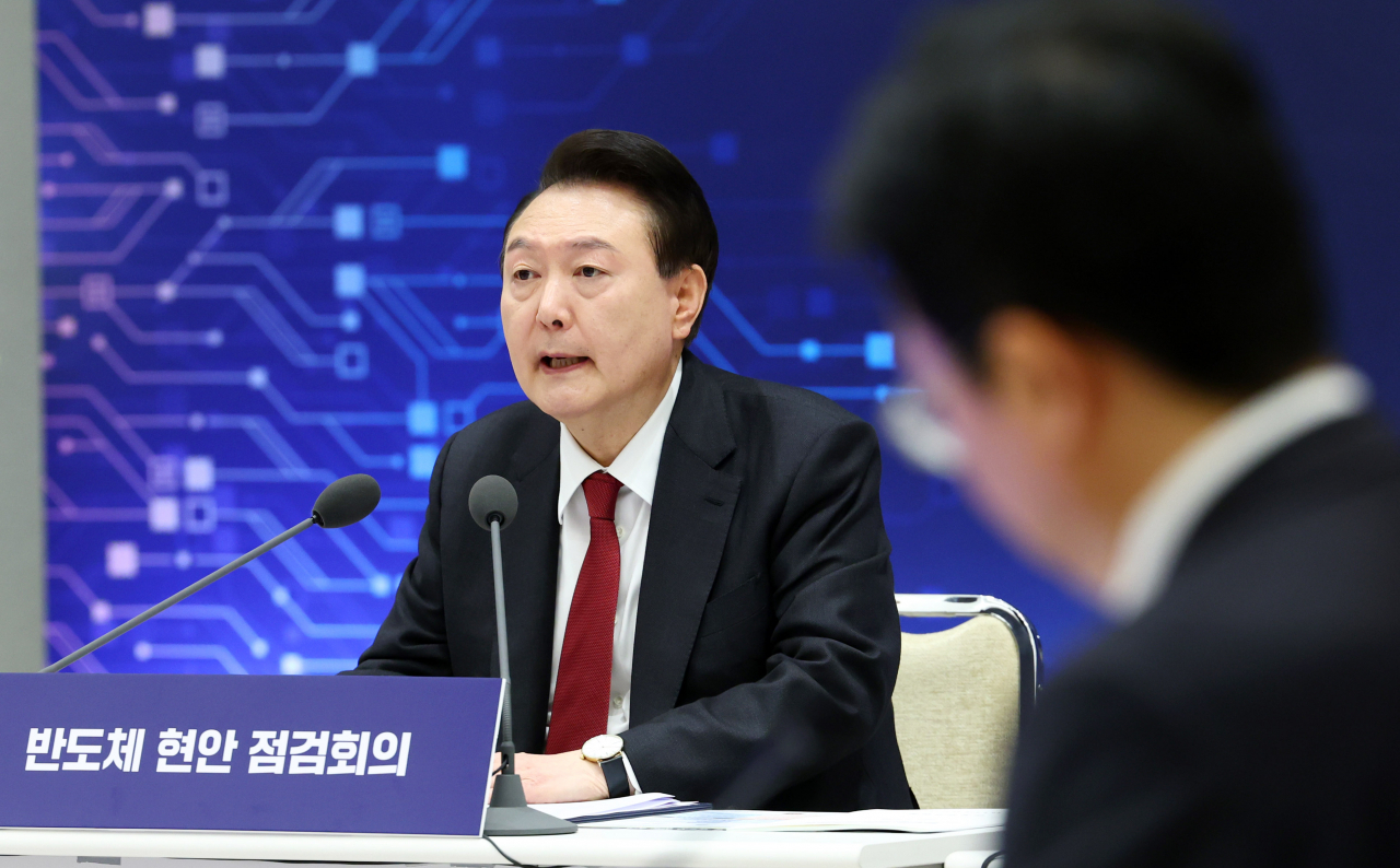 President Yoon Suk Yeol speaks during a meeting with chip industry leaders on current affairs related to the semiconductor industry, at the presidential office in Seoul, Tuesday. (Pool photo via Yonhap)
