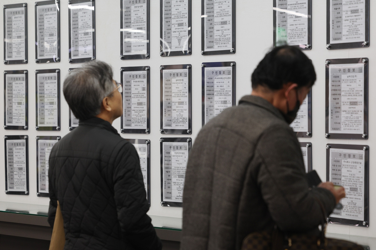 Jobseekers check job postings at an employment center in Seoul, in this file photo taken March 13, 2024. (Yonhap)