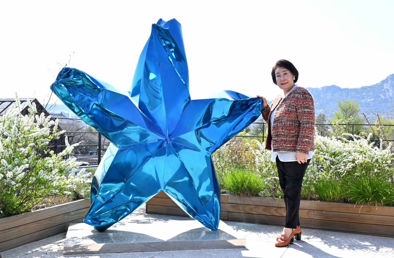 Lee Hyun-sook, founder of the Kukje Gallery, poses for a photo next to 