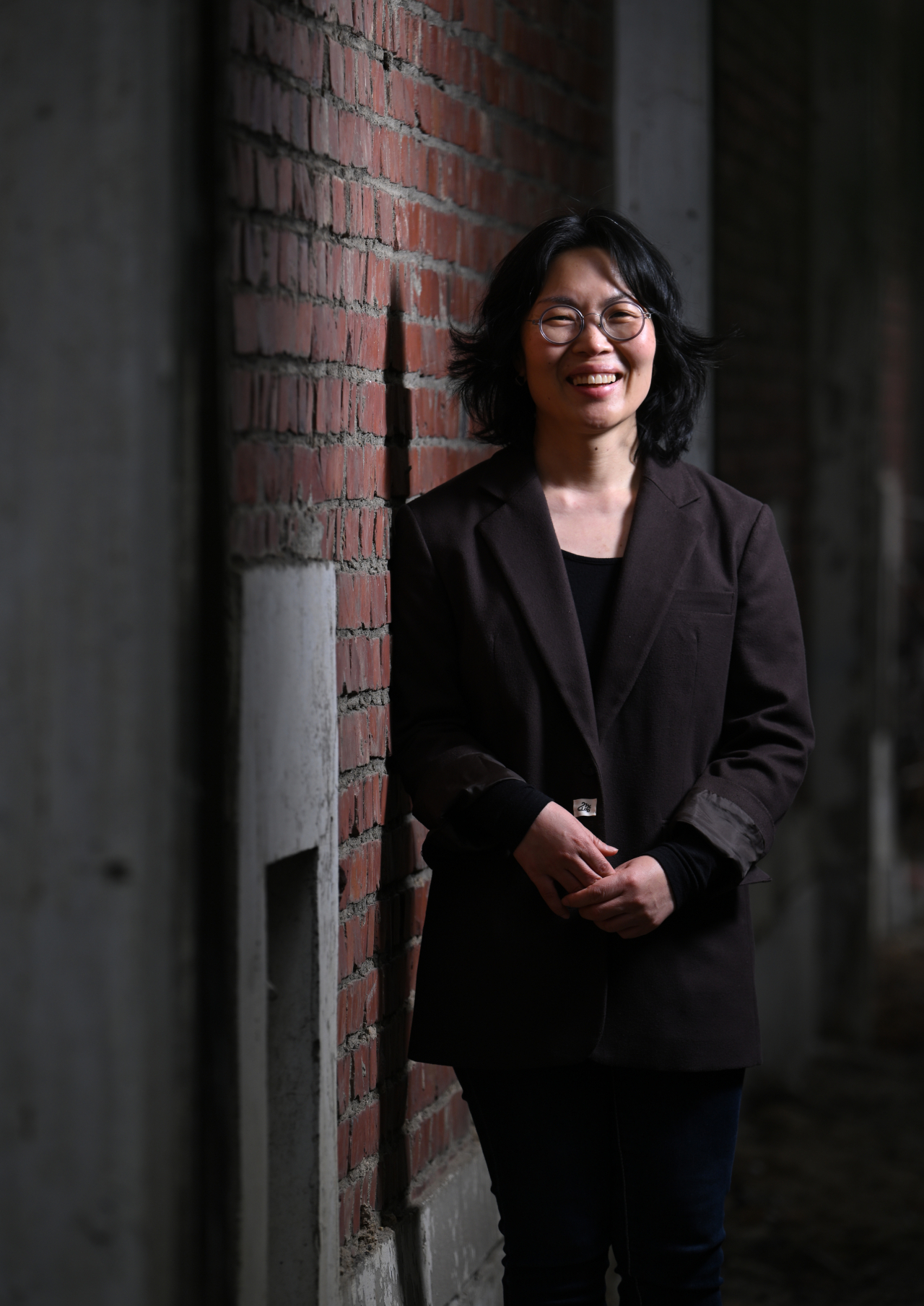 Jung Ju-yeon, founder and executive director of Wear Again Lab, poses for a photo near her office in Seongsu-dong, Seoul, April 5. (Im Se-jun/The Korea Herald).