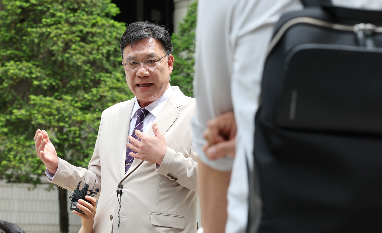 Lee Byeong-cheol, a lawyer, speaks to reporters after a court hearing on April 26 at the Seoul Central District Court. (Yonhap)