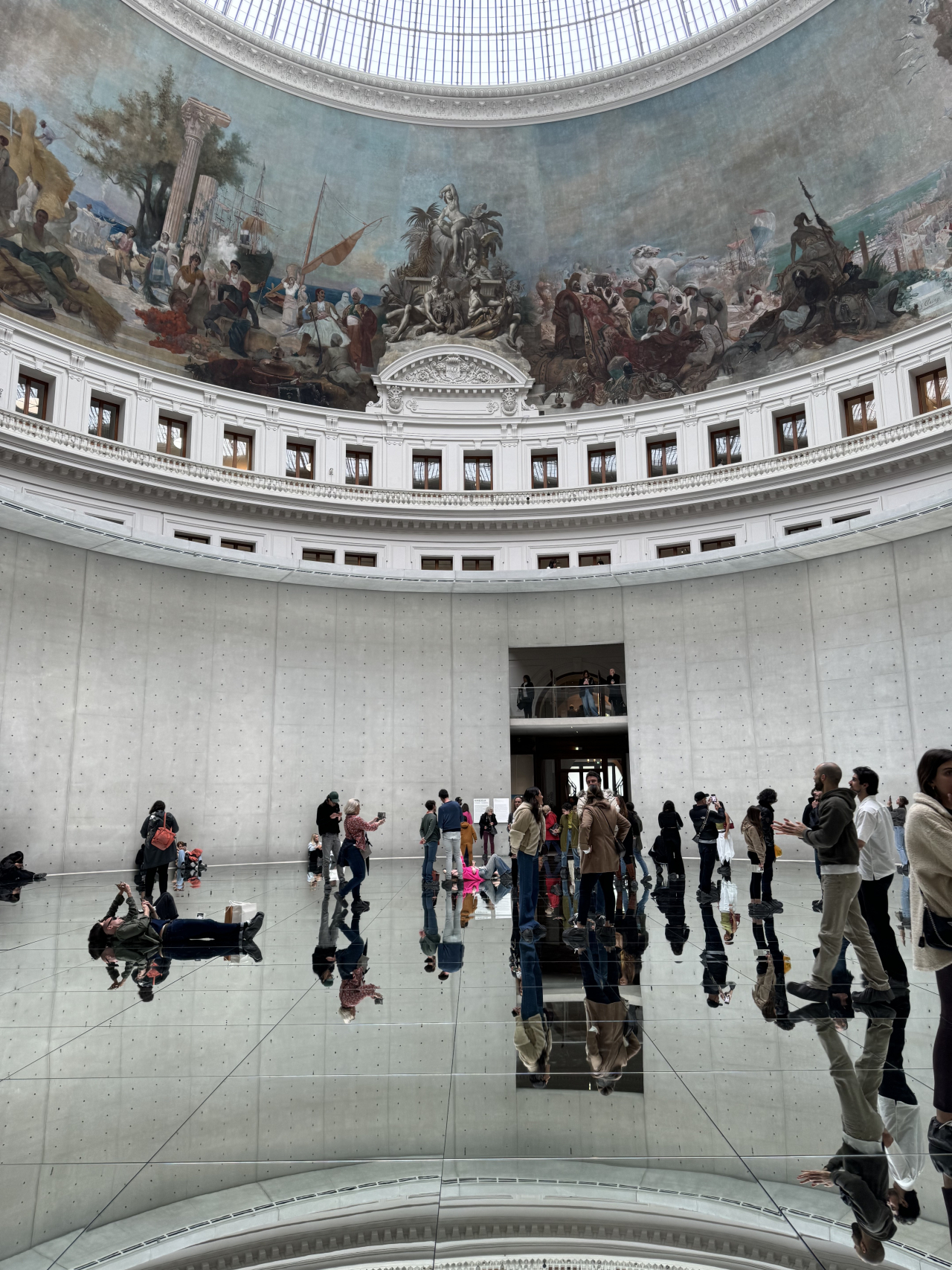 Vistors are seen inside The Rotunda of the Bourse de Commerce in Paris, France on May 2, where Kimsooja's carte blanche project 