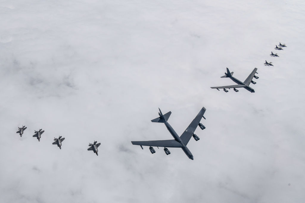 Two US Air Force B-52H strategic bombers (center) flying with South Korean Air Force F-35A (left) and US Air Force F-16 (right) fighter jets during a joint air drill on April 14, 2023 (South Korean Defense Ministry)
