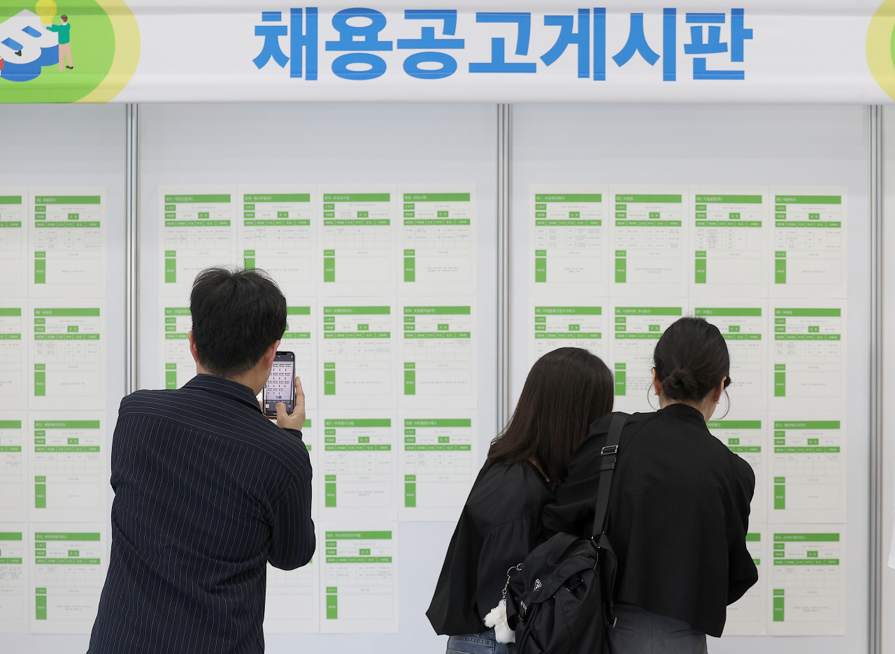 Jobseekers check job postings at a job fair in the southeastern city of Gyeongsan on May 10, 2024. (Yonhap)