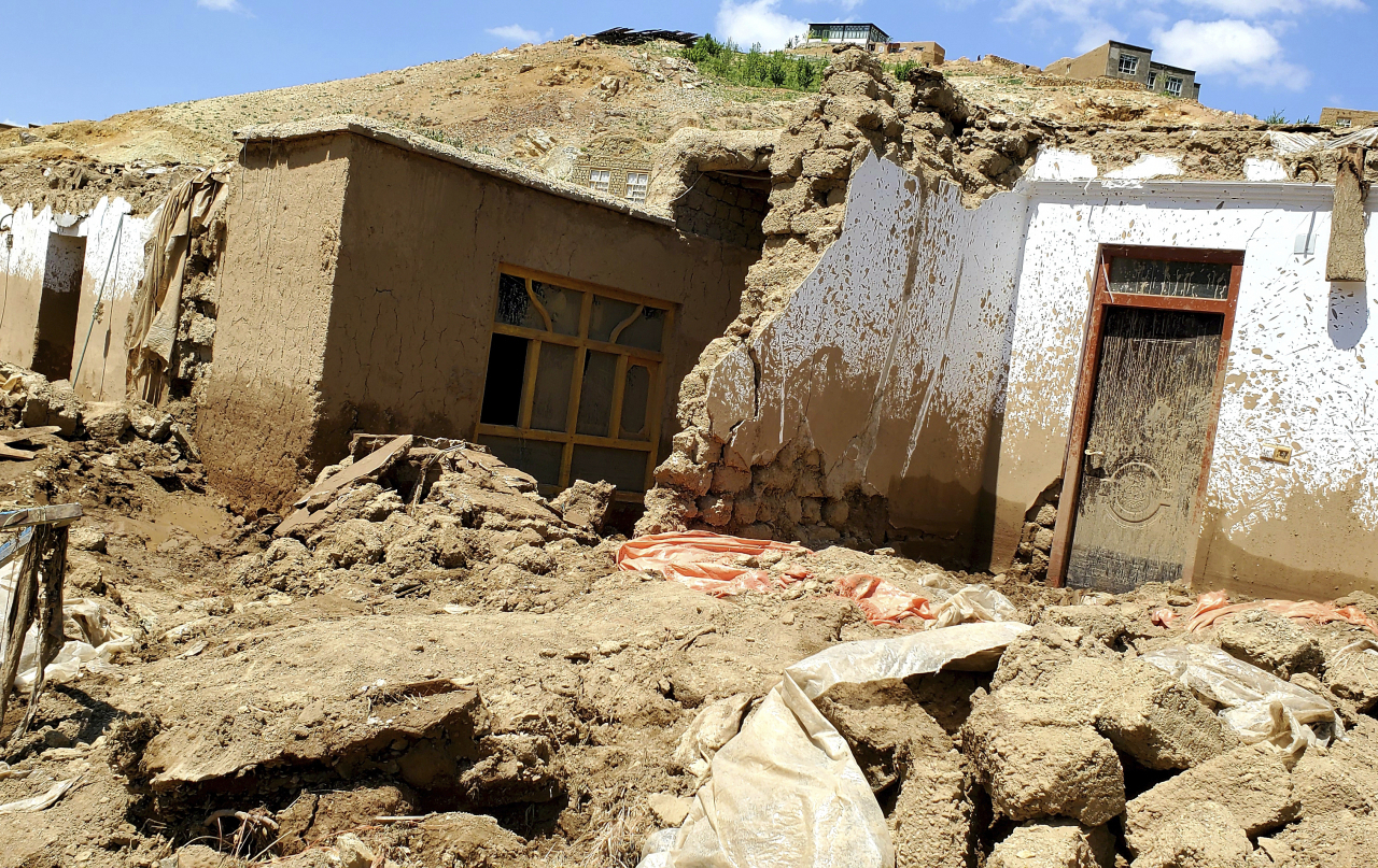 A damaged house is seen after heavy flooding in Ghor province in western Afghanistan, Saturday. (AP-Yonhap)