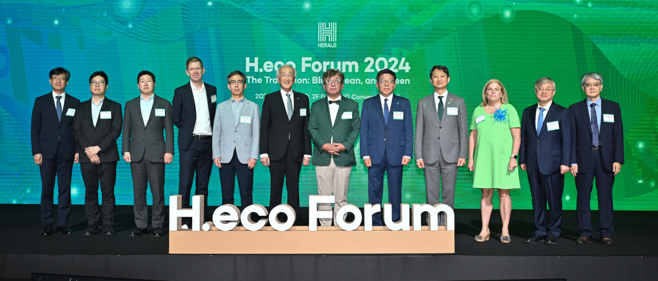From left: Lee Chang-heum, deputy minister of the climate change and carbon neutral policy office of the Environment Ministry; Jeong Gyu-chang, Hanwha Solution’s business supporting team manager; Kim Gi-hong, McKinsey & Company’s partner; Andreas Munk-Janson, Orsted’s APAC operations head; Hong Jong-ho, professor of economics at Seoul National University; Nobuo Tanaka, executive director emeritus of the International Energy Agency; Kim Sang-hyup, co-chairperson of the Presidential Commission on Carbon Neutrality and Green Growth; Choi Jin-young, president of Herald Media Group; Ahn Duk-geun, minister of Trade, Industry and Energy; Maria Castillo Fernandez, EU ambassador to Korea; Yoo Yeon-chul, executive director of the UN Global Compact Network Korea; and Jerng Dong-wook, professor of energy systems engineering at Chung-Ang University, pose for a photo during the H.eco Forum 2024 held at Some Sevit in Seoul on Wednesday. (Lee Sang-sub/The Korea Herald)