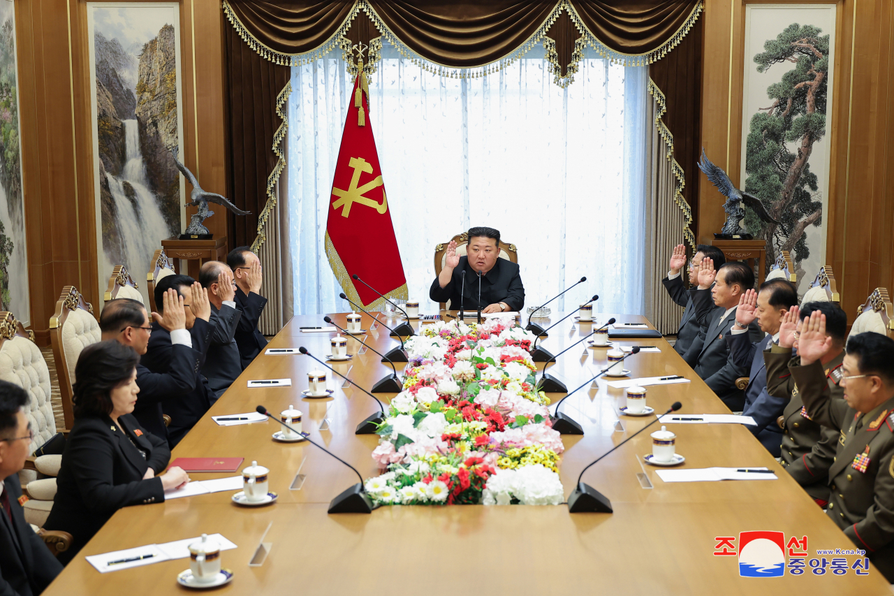 North Korean leader Kim Jong-un attends a politburo meeting of the central committee of the ruling Workers' Party of Korea on Friday in this photo released by the North's official Korean Central News Agency the next day. (Yonhap)