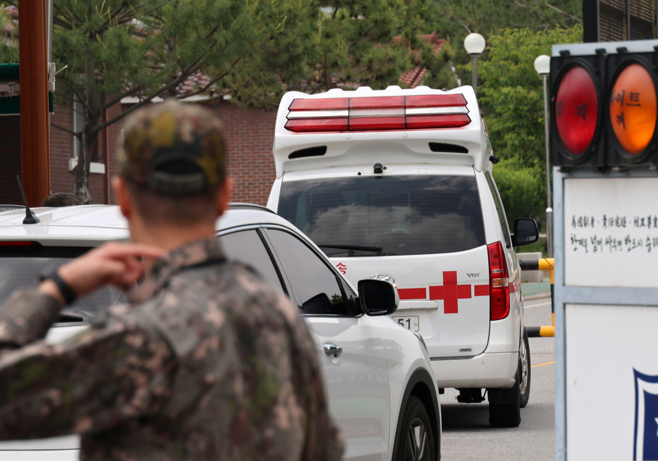 An ambulance enters the Army's 32nd Infantry Division in Sejong, 113 kilometers south of Seoul, on Tuesday. (Yonhap)