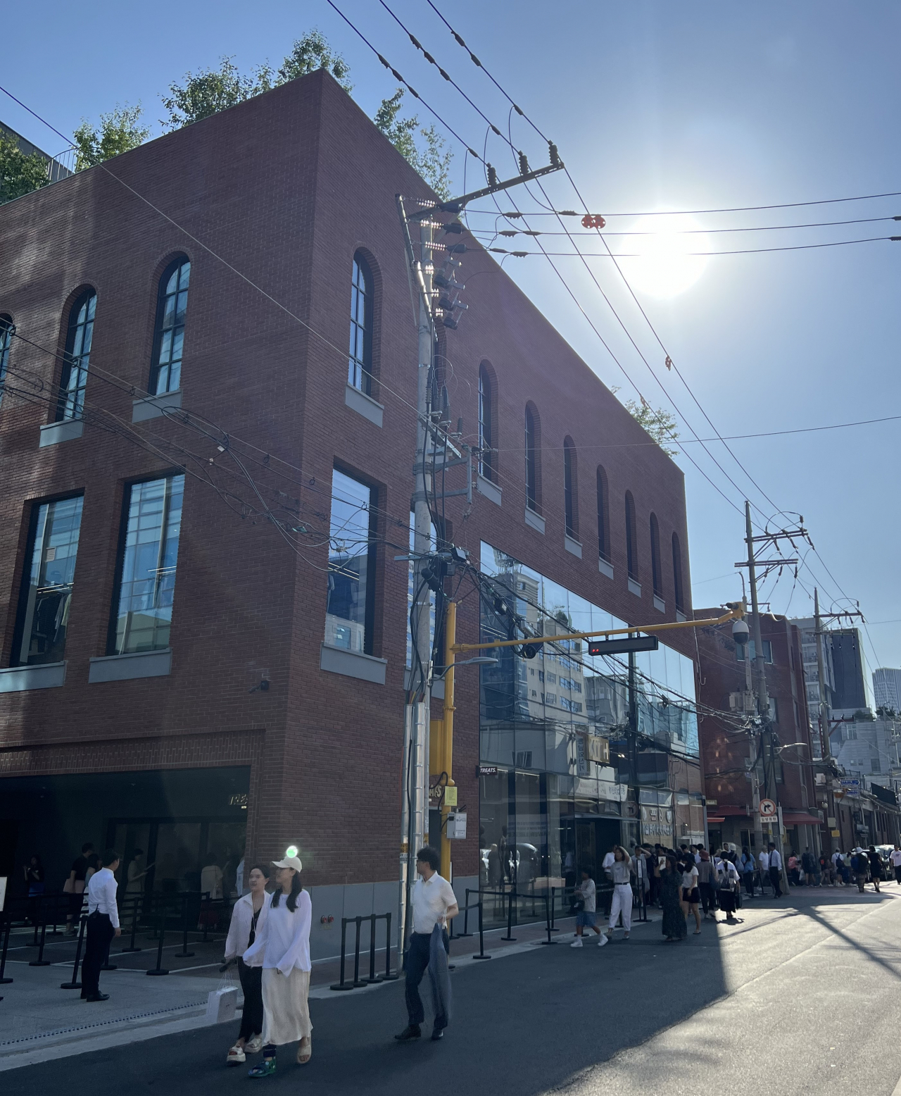 People walk by Kith Seoul store in Seoul, on June 13. (Kim Jae-heun/The Korea Herald)