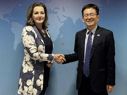 Kim Jin-dong, right, director general for bilateral economic affairs at the South Korean foreign ministry, and Yvette van Eechoud, deputy director general for foreign economic relations at the Dutch foreign ministry, pose for a photo during their economic security talks in The Hague, on Friday, in this image provided by the Seoul ministry.
