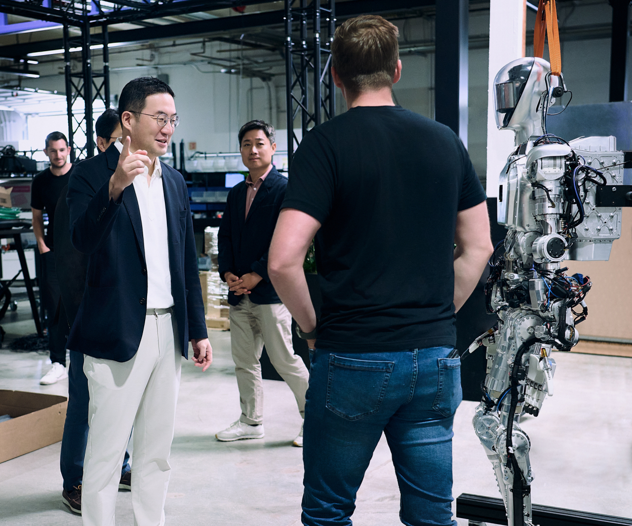 LG Group Chairman Koo Kwang-mo (left) observes Figure AI’s humanoid robot, Figure 01, in action, at the startup's headquarters in Sunnyvale, California. (LG Inc.)
