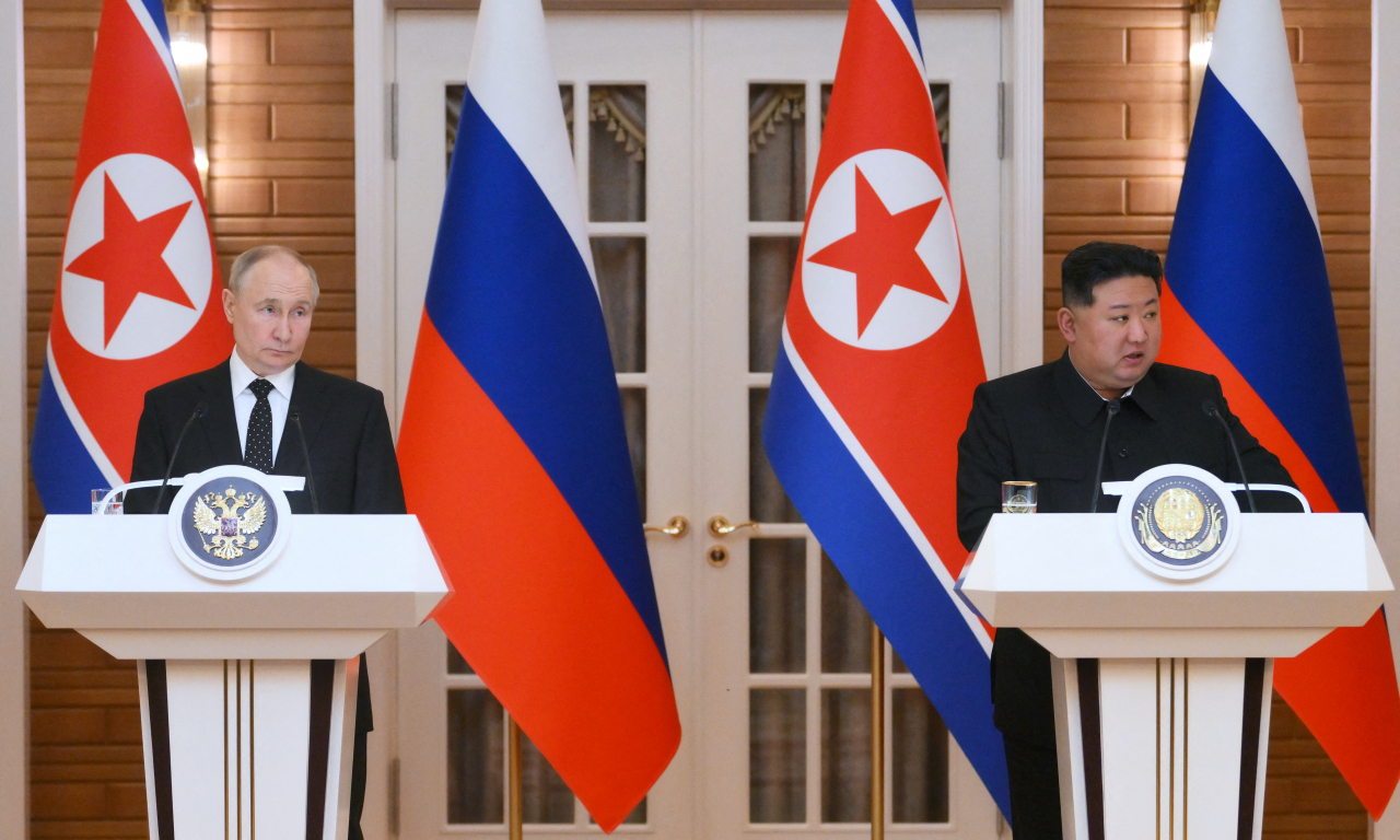 Russia's President Vladimir Putin (left) and North Korea's leader Kim Jong-un attend a press conference following their talks in Pyongyang, North Korea June 19, 2024. (Sputnik via Reuters)