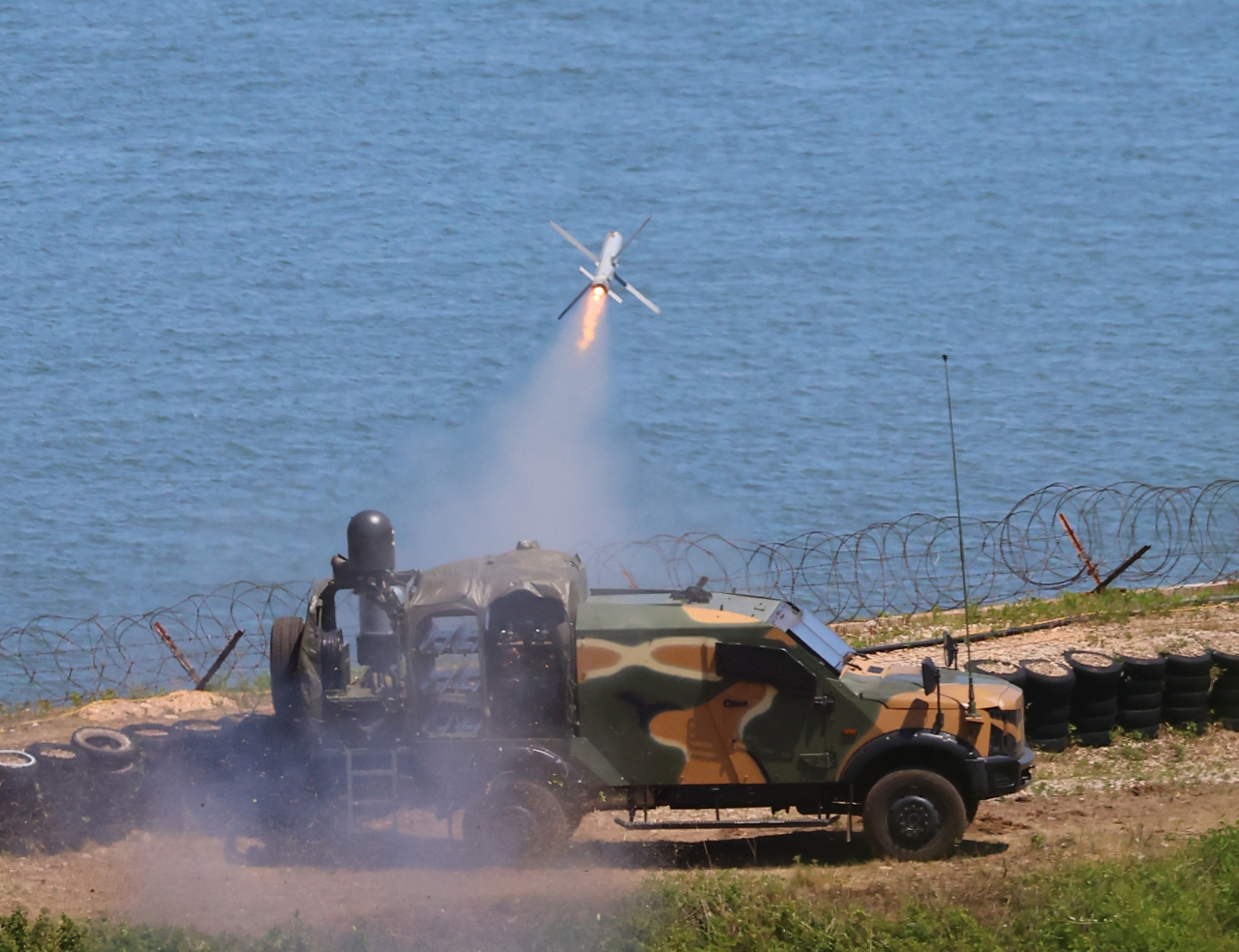 A South Korean Marine Corps tank fires a missile into the waters off Yeonpyeong Island, south of the maritime border with North Korea, in the first such drills held in six years and 10 months, Wednesday. (Yonhap)