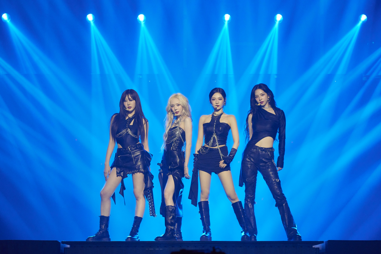 From left: aespa members Giselle, Winter, Ningning and Karina perform during the group's concert held at Jamsil Indoor Stadium, Seoul, Sunday. (SM Entertainment)
