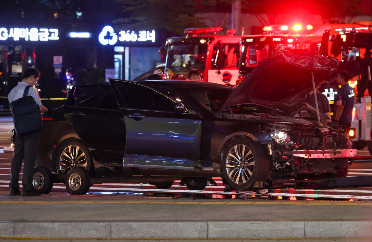 This photo taken early Tuesday in Seoul shows a completely destroyed car that was driven by a driver responsible for Monday's deadly accident, in which nine people were killed and four more were injured. (Yonhap)