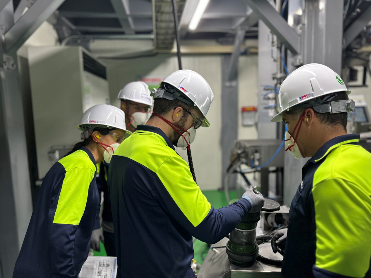 Ultium CAM's employees are training on quality analysis, including the air-shooting system, at a cathode material plant in Pohang, North Gyeongsang Province, Tuesday. (Posco Future M)