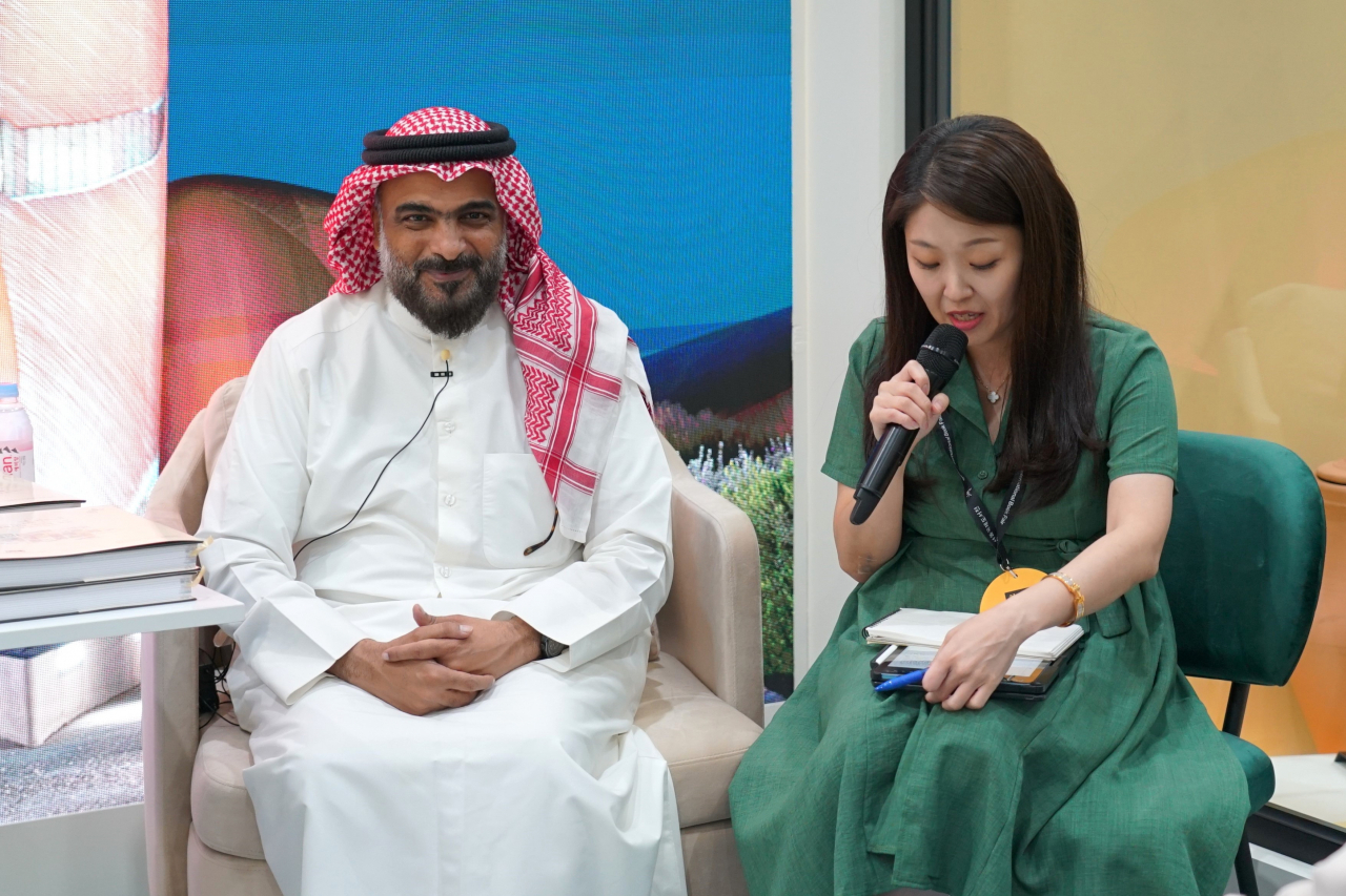 Tariq Khawaji (left) attends a book launch ceremony for the Korean edition of 
