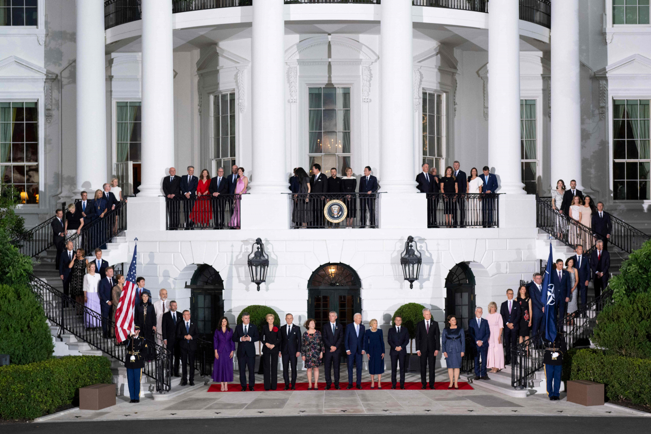 The Heads of State of NATO pose with US President Joe Biden and NATO Secretary General Jens Stoltenberg (center) at a photo op in the South Lawn of the White House before a State dinner at the NATO 75th anniversary summit celebration in Washington, DC, on Wednesday. (AFP)