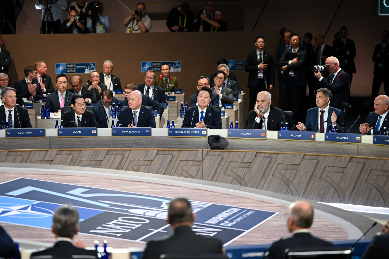 President Yoon Suk Yeol (fourth from left) attends a session of the North Atlantic Treaty Organization's allies and partners held at the Walter E. Washington Convention Center in Washington on Thursday (Yonhap)