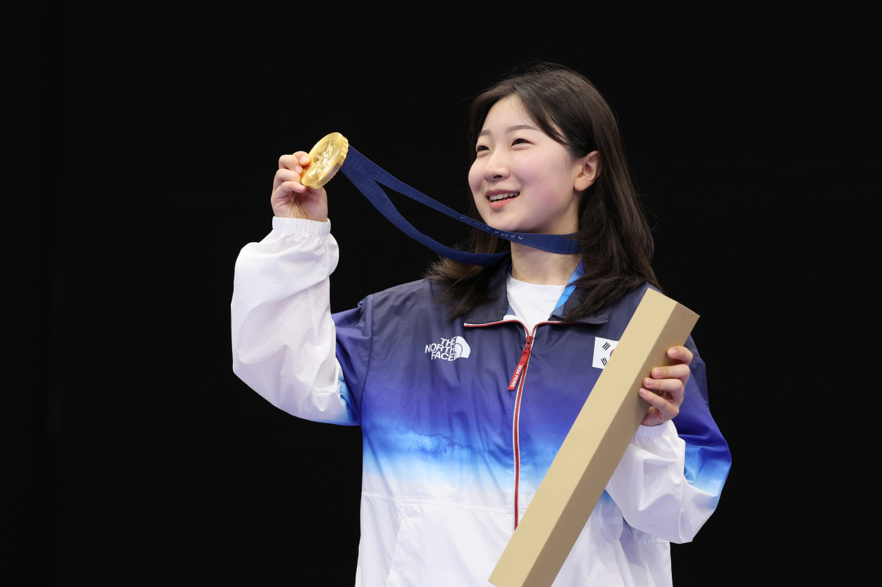 Ban Hyo-jin of South Korea celebrates after winning the gold medal in the women's 10-meter air rifle at the Paris Olympics at the Chateauroux Shooting Centre in Chateauroux, France, Monday. (Yonhap)