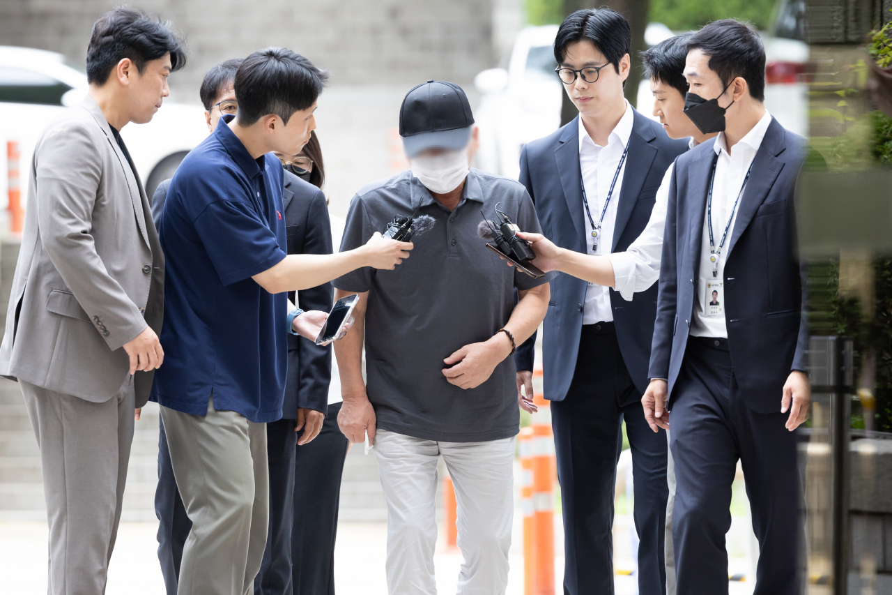 The 68-year-old driver behind the fatal car crash that killed nine pedestrians near Seoul City Hall on July 1 attends an arrest warrant hearing at Seoul Central District Court, Tuesday. (Yonhap)