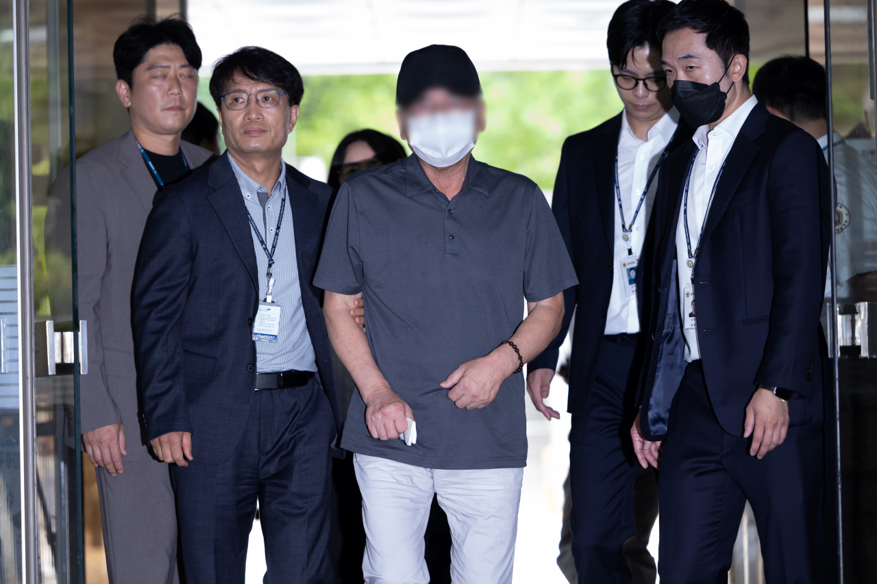 A driver of a car that barreled into pedestrians and killed nine in central Seoul earlier this month attends an arrest warrant hearing on Tuesday. (Yonhap)