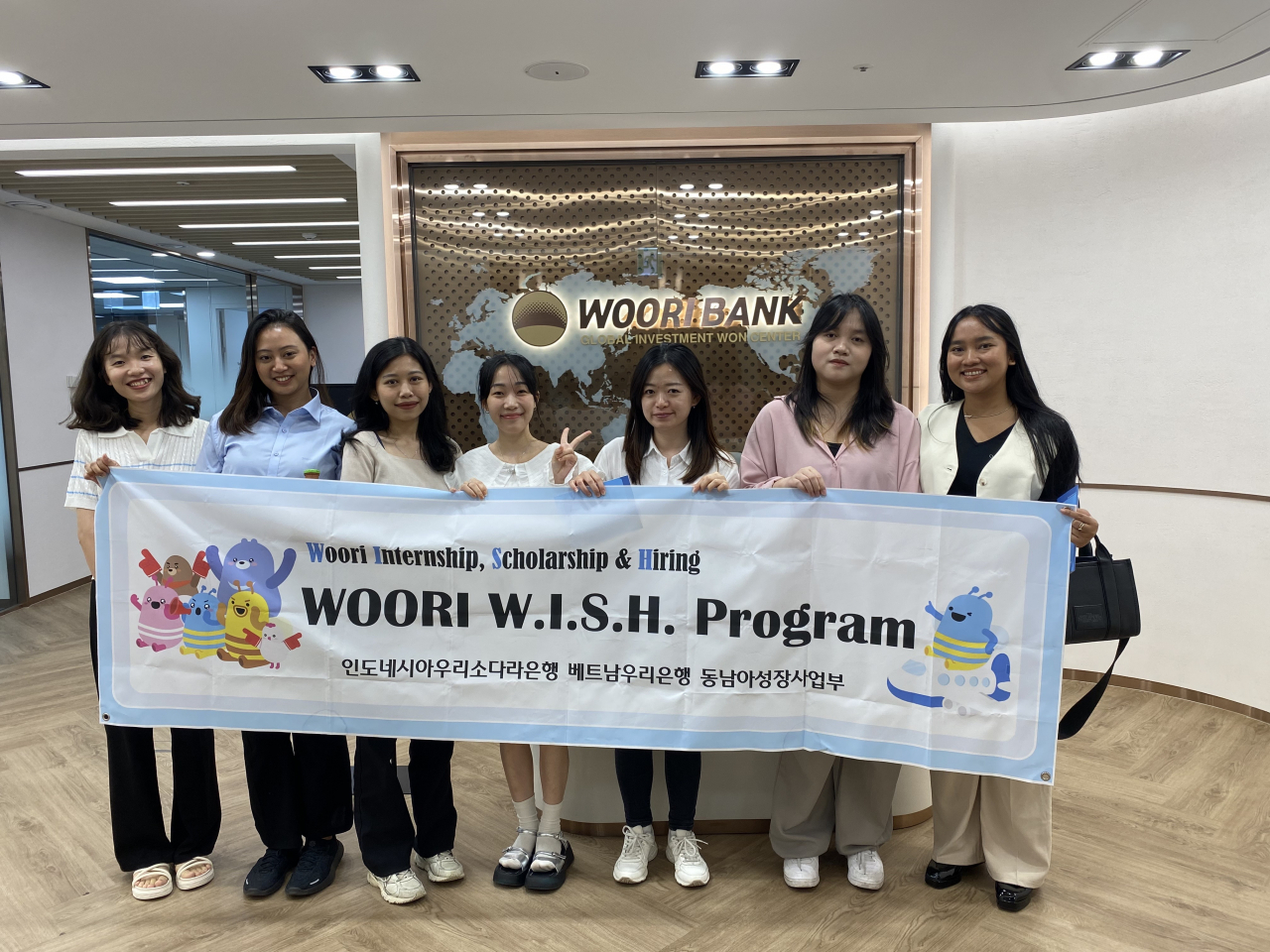 Betary Syahlan (second from left), Xuan Le (fourth from left) and Andari Candrika (far right) pose for a picture along with other participants of 