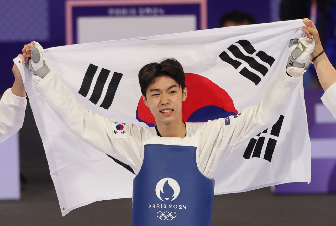 Park Taejoon wins gold medal in men's taekwondoThe Korea Herald view