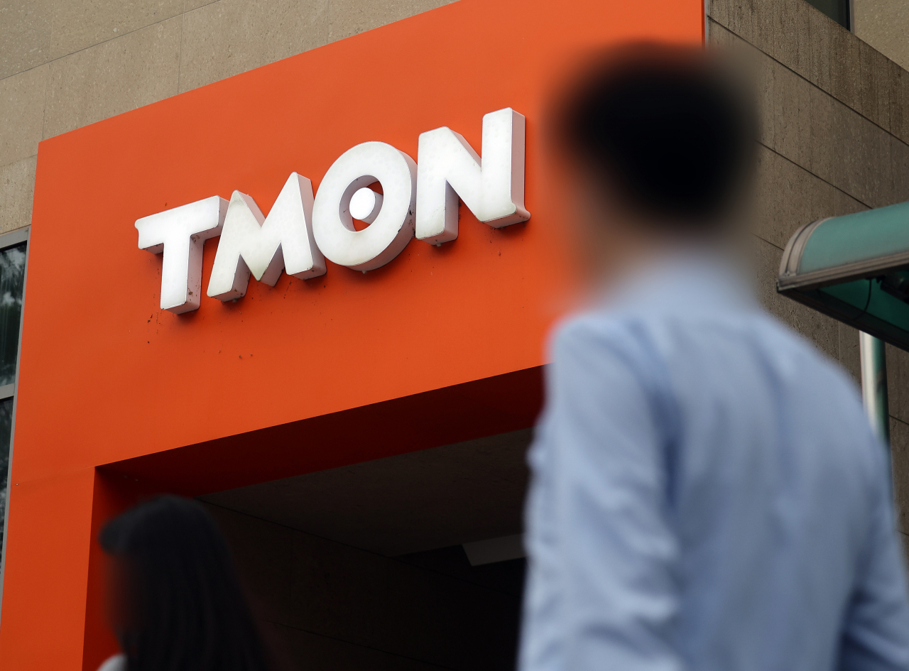 A person walks by Tmon headquarters in southern Seoul. (Yonhap)